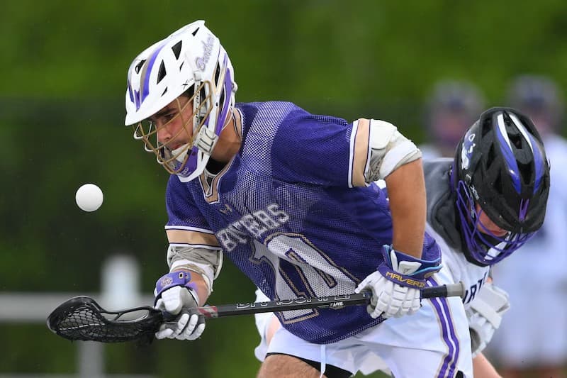 Chris O'Connor winning a faceoff during a high school game